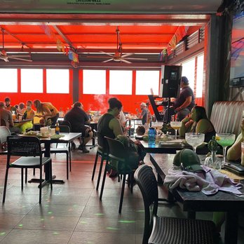 Solluna - Patrons can retreat from the rain while enjoying giant drinks & smoke hookahs - Mexican Near Me - Fort Lauderdale, Florida Solluna - Patrons can retreat from the rain while enjoying giant drinks & smoke hookahs - Mexican Near Me - Fort Lauderdale, Florida