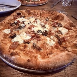 Fig, leek, and prosciutto pizza with hot honey Fig, leek, and prosciutto pizza with hot honey