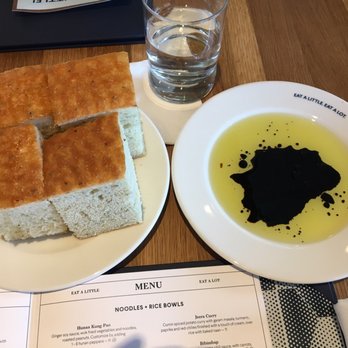 Earls Kitchen + Bar - Italian style pan bread - for $2.50 it's a must! Has rosemary notes and salted top. - New American Near Me - Orlando, Florida