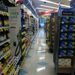 a grocery store aisle with a free gas sign a grocery store aisle with a free gas sign