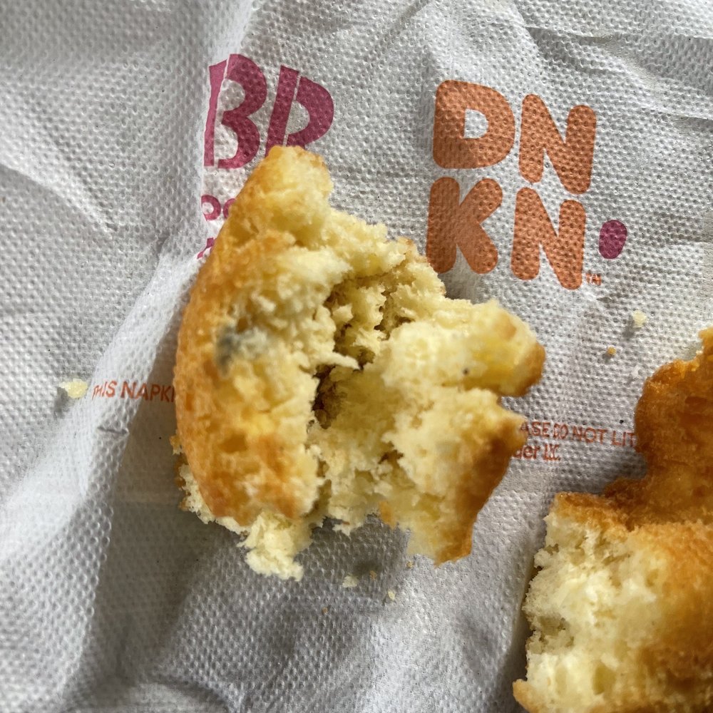 Dunkin' -  a half eaten doughnut on a piece of paper - Donuts Near Me - New Port Richey, Florida