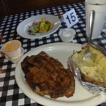 Bubba's BBQ & Steakhouse - Cowboy Ribeye. At Bubba 's. Backed potatoe & salad. - Barbeque Near Me - Ennis, Texas