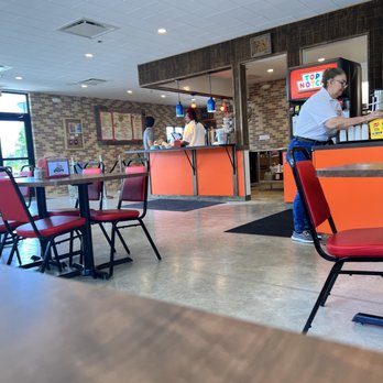 Top Notch - a restaurant with tables and red chairs - Burgers Near Me - Hutto, Texas Top Notch - a restaurant with tables and red chairs - Burgers Near Me - Hutto, Texas