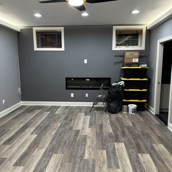 L&R Contractors - Bedroom with bulkhead lighting, and new electric fireplace - General Contractors Near Me