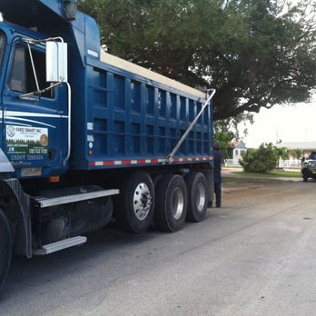 Yard Smart - a blue dump truck parked on the side of the road - Landscaping Near Me - Medley, Florida