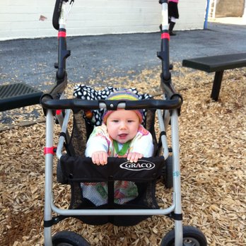 Traditions TLC - Baby in basket, play time at the park with kids using Traditions TLC. - Nanny Services Near Me Traditions TLC - Baby in basket, play time at the park with kids using Traditions TLC. - Nanny Services Near Me