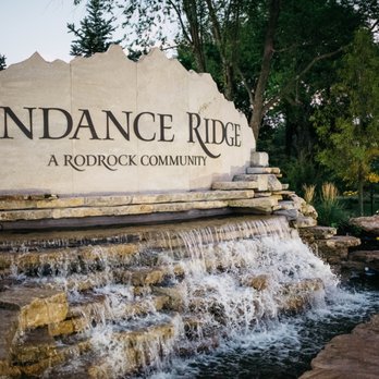 Epic Landscape Productions - a fountain in front of a sign that reads sundance ride - Landscaping Near Me - Gardner, Kansas Epic Landscape Productions - a fountain in front of a sign that reads sundance ride - Landscaping Near Me - Gardner, Kansas