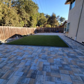 Ramos Landscaping - a patio with artificial turf - Landscaping Near Me