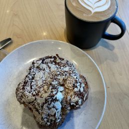latte break with a double baked almond croissant latte break with a double baked almond croissant