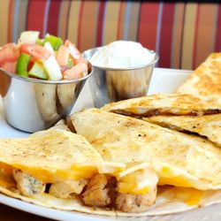 GrillFriends - Chicken Quesadillas  Chicken, Jack Cheese, Peppers & Onions. Served with a side of Sour Cream and homemade Salsa Fresca *can be done GF!