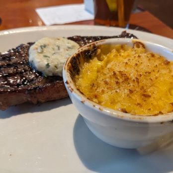 Black Angus Steakhouse - NY strip with garlic butter and mac and cheese - Steakhouses Near Me - Bakersfield, California