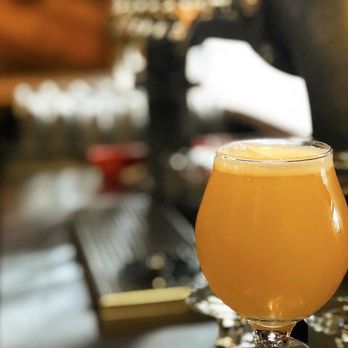Flying Tiger - a glass of beer on a table - Breweries Near Me - Monroe, Louisiana