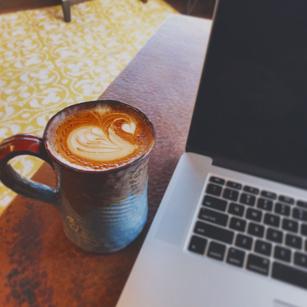 Artisan Coffee - White Cozy Mocha LatteArt and Macbook - Coffee & Tea Near Me - Akron, Ohio