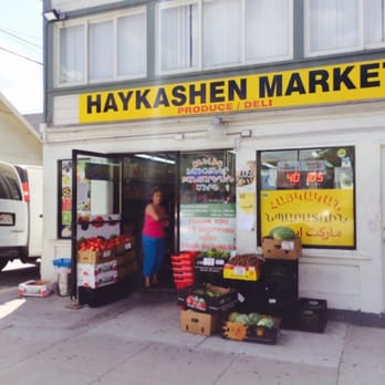 Haykashen Market - a woman standing in front of the store - Grocery Near Me - Glendale, California