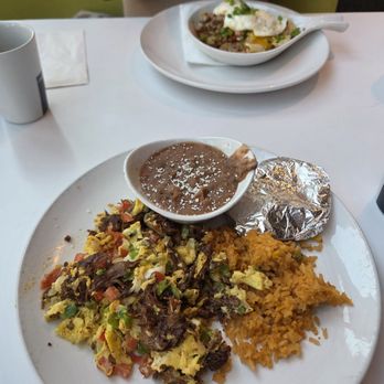 Broken Yolk Cafe - Background is the meat lover's skillet. Foreground is my machaca. - Breakfast & Brunch Near Me - Las Vegas, Nevada Broken Yolk Cafe - Background is the meat lover's skillet. Foreground is my machaca. - Breakfast & Brunch Near Me - Las Vegas, Nevada