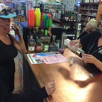 Liquor Depot - a woman pouring a glass of wine - Beer, Wine & Spirits Near Me - Rock Springs, Wyoming