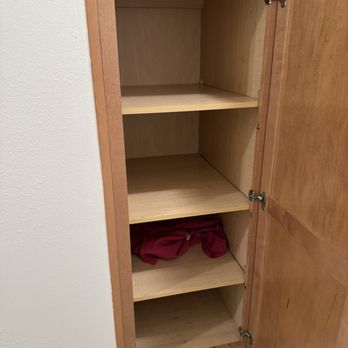 Avalon Westbury - Used Clothing in cabinet - Apartments Near Me - Westbury, New York