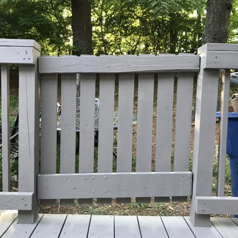 Deck Renovations - a deck with a fence and trash can - Decks & Railing Near Me Deck Renovations - a deck with a fence and trash can - Decks & Railing Near Me