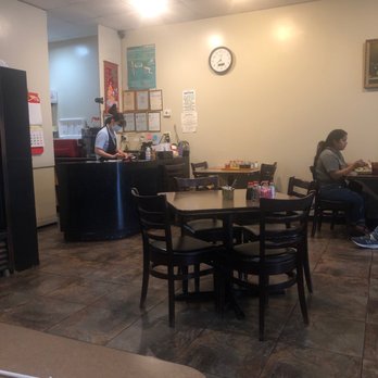 Dumpling King - Tables, service desk.There is an $8 cover charge per bottle of wine brought In - Chinese Near Me - Houston, Texas