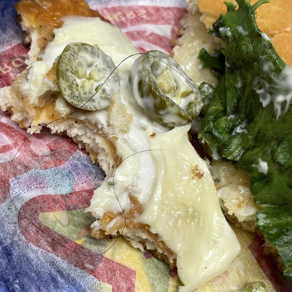 Carl's Jr - a piece of pizza with cheese and vegetables - Fast Food Near Me - Riverside, California