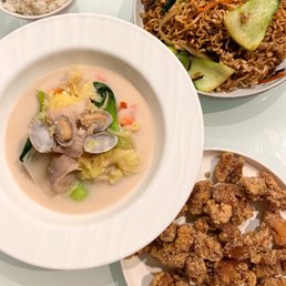 a bowl of soup, a plate of fried chicken, and a bowl of rice a bowl of soup, a plate of fried chicken, and a bowl of rice