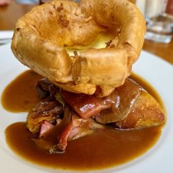 The Lamb At Angmering - Roast Passmore farm beef - garlic roasted potatoes, honey glazed parsnip, cauliflower cheese, mixed vegetables, Yorkshire pudding, and gravy