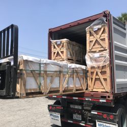 Apex Granite Outlet - Unloading Granite Countertop from container.