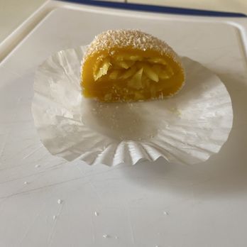 Hong Kong Bakery and Cafe - Half of a mango mochi with fresh green mango inside - Bakeries Near Me - Mountain View, California