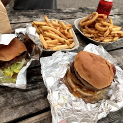 Sonny's Drive In - Double Banquet burger (right), bacon burger (lift), fries, fries and onion ring combo