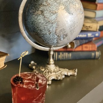 Maize + Mash - a globe and a drink on a table - Southern Near Me - Glen Ellyn, Illinois