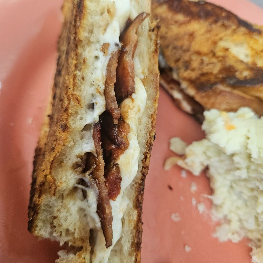 Toula's Trailside Cafe - Added bacon to the caprese grilled cheese on French bread - Breakfast & Brunch Near Me - Tarpon Springs, Florida Toula's Trailside Cafe - Added bacon to the caprese grilled cheese on French bread - Breakfast & Brunch Near Me - Tarpon Springs, Florida