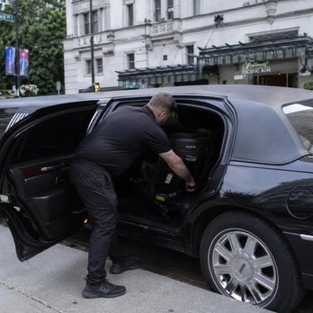 North Lux Drive - chauffeur professionally installing a child car seat - Limos Near Me - Coquitlam, British Columbia North Lux Drive - chauffeur professionally installing a child car seat - Limos Near Me - Coquitlam, British Columbia