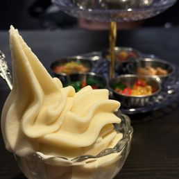 Cereal milk soft serve with tower of toppings