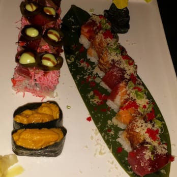 Umami Sushi - Tiger Roll  (right side) recommend  Titanic Roll (left side)  OK Uni Roll (2 pieces only)  expensive -just trying - Sushi Bars Near Me - Lutz, Florida