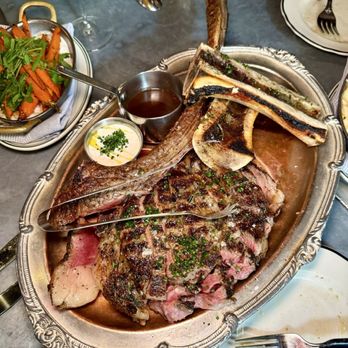Meat & Potatoes - 50 oz Tomahawk - long bone ribeye / bone marrow cognac sauce / horseradish sauce / potatoes (we picked pave potatoes!) - New American Near Me - Pittsburgh, Pennsylvania