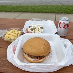 Balkan Burger Traditional style with fries and Greek salad.