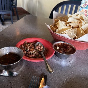 Lupe Tortilla Mexican Restaurant - Spicy charro beans served first as dip with chips and later with fajitas- - best charro spicy beans around!! - Tex-Mex Near Me - Shenandoah, Texas
