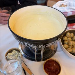 Fondue for 2 It came with bread and potatoes (no veggies at this place sadly) Fondue for 2 It came with bread and potatoes (no veggies at this place sadly)