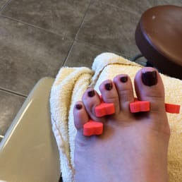 My toes after the pedicure.. I can't wait to get home to get that hideous work fixed..