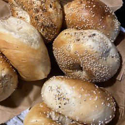a variety of bagels in a basket