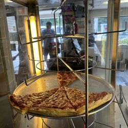 Chesley's Mini Mart & Pizza - Ou can buy a whole pizza or get it by the slice