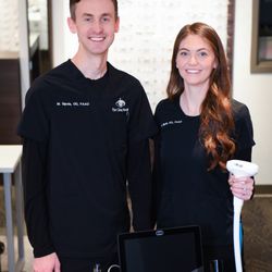 Eye Clinic North - Dr. Matt and Dr. Hannah Sipola posing with their Envision IPL dry eye treatment device