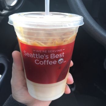 Zippy's Tacos - a hand holding a cup of coffee - Mexican Near Me - Bowie, Texas