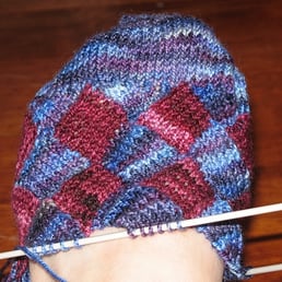 The blue Koigu was purchased at The Yarnery.  The red Koigu came from elsewhere.
