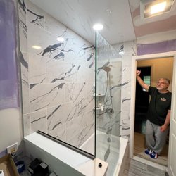 Roeland Home Improvers - Custom designed bathroom with 1/2 glass wall