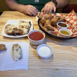 The Fold Goshen - Chicken wings with jerk sauce, garlic parm sauce, ranch and garlic cheese bread with marinara