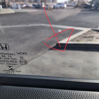 Pros Auto Detailing - Tint placed on top of a sticker. the installer must have felt resistance but he didn't care just kept on going over it. - Auto Detailing Near Me - Downey, California