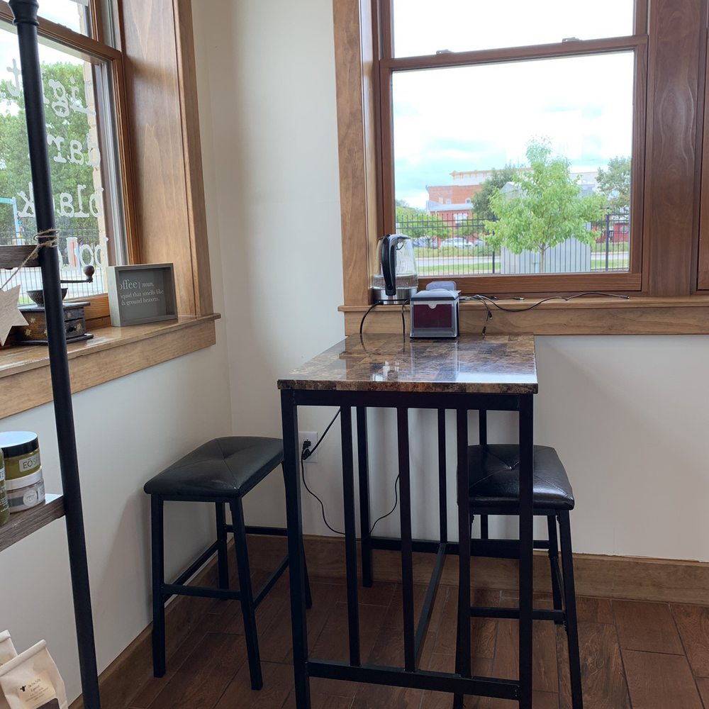 Bold Brew House - a table and two stools in front of a window - Coffee & Tea Near Me - Macomb, Illinois