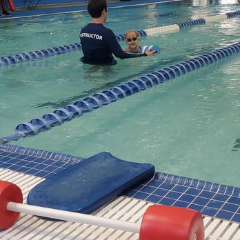 Fullerton Family YMCA - My daughter practicing arm movements while Mr. Darren holds the floating dumbell. - Gyms Near Me - Fullerton, California