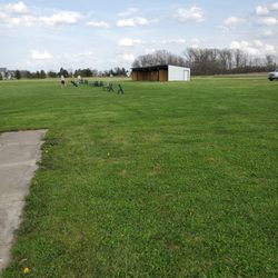 Wedgewood Golf Driving Range - Tee Line with covered canopy in the background.